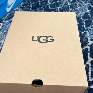 Pink and black UGG slippers